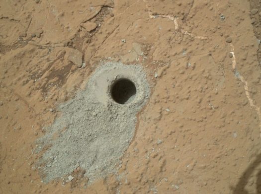  The hole drilled into this rock target, called "Cumberland," was made by NASA's Mars rover Curiosity on May 19, 2013. Credit: NASA/JPL-Caltech/MSSS 