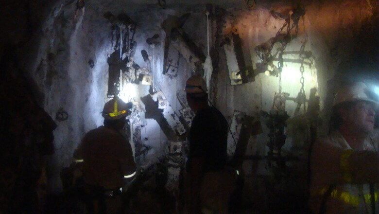 Scientists, including Borgonie (right), deep underground at Northam Platinum mine in South Africa. (Marc Kaufman)