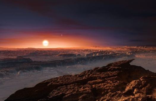 This artist ’ s impression shows a view of the surface of the planet Proxima b orbiting t he red dwarf star Proxima Centauri, the closest star to the Solar System. The double star A lpha Centauri AB also appears in the image to the upper-right of Proxima itself. Proxima b is a little more massive than the Earth and orbits in the habitable zone around Proxima Centauri, wh ere the temperature is suitable for liquid water to exist on its surface. Credit: ESO/M. Kornmesser 